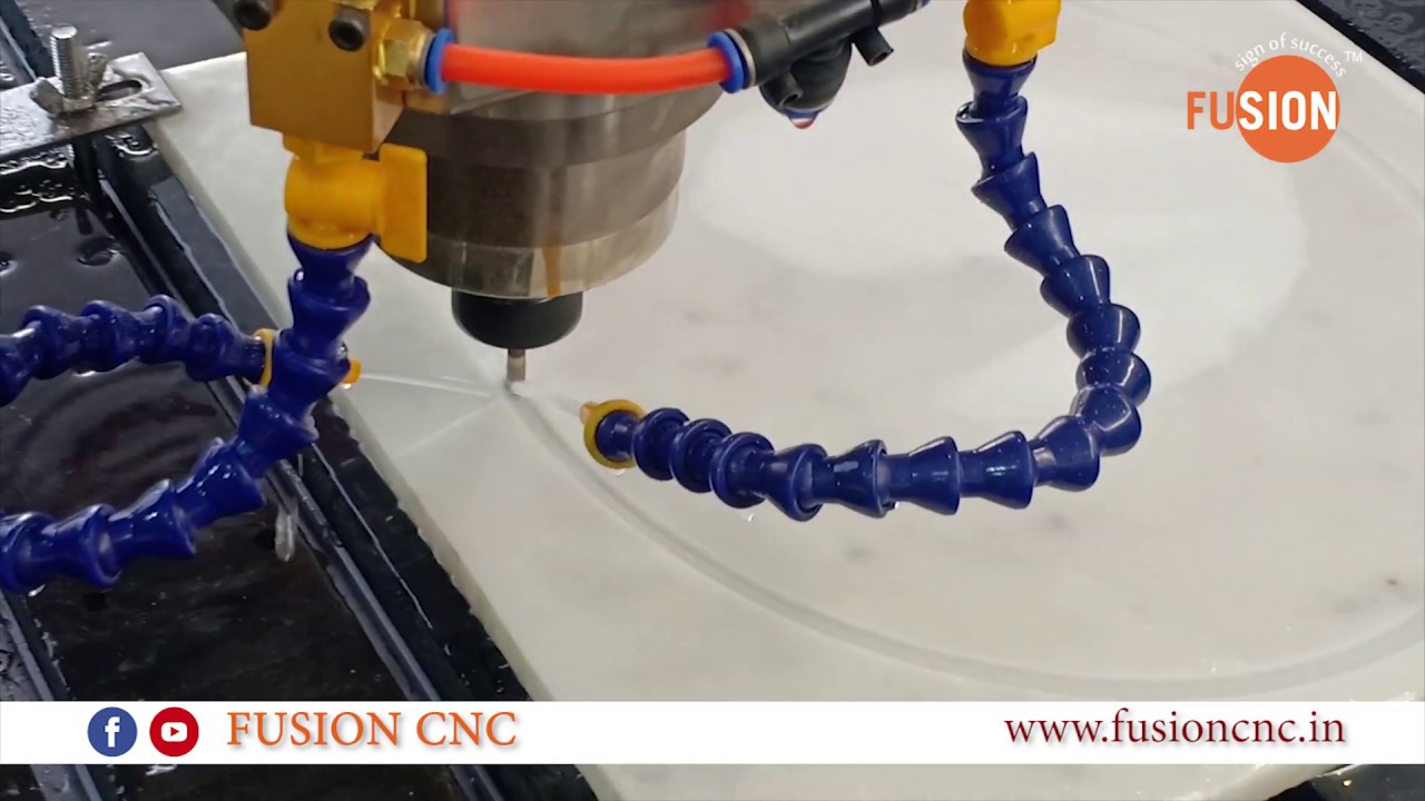3 axis CNC machine working wood and stone